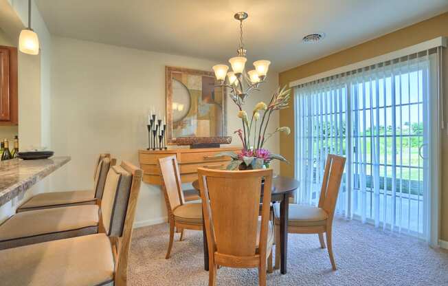 large dining area with sliding glass doors