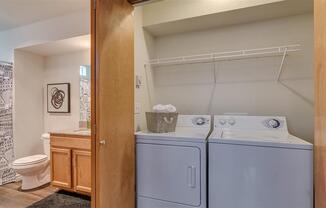Spokane Apartments - Canyon Bluffs - Washer-and-Dryer in a Closet with Storage Space Next to Bathroom