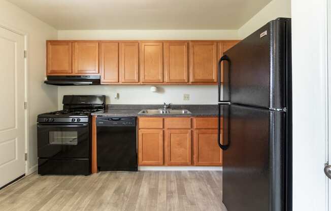 This is a photo of the kitchen in the 1004 square foot, 2 bedroom, 1.5 bath townhome floor plan at Lake of the Woods Apartments in Cincinnati, OH.