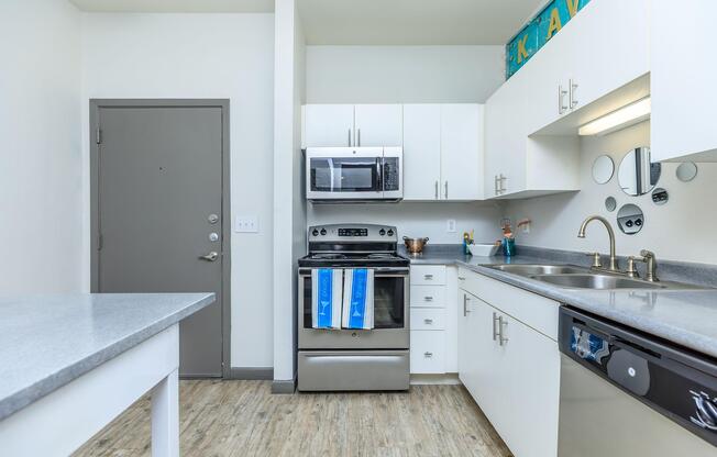 a kitchen with a stove and a sink