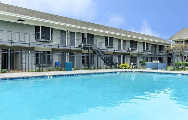 a large pool of water in front of a house