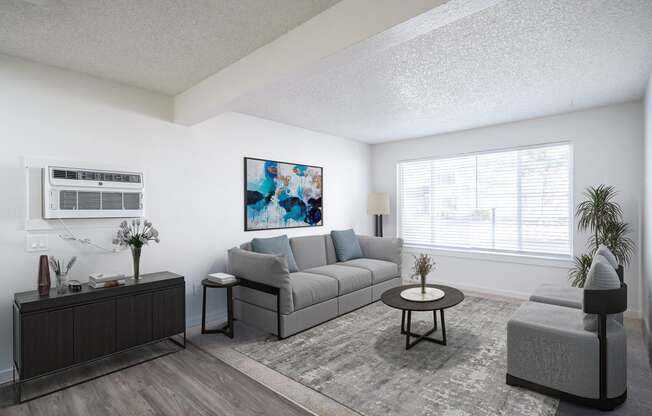 a living room with white walls and a large window at Kirkwood Meadows, Pocatello, 83201