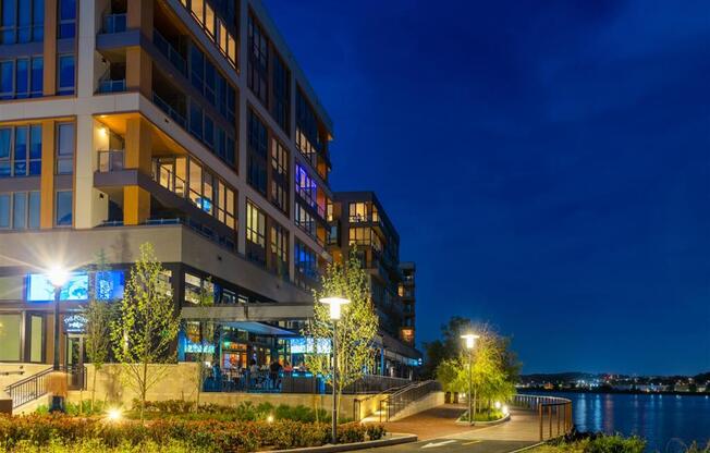 RiverPoint apartments in Washington, DC night view of the waterfront side of building
