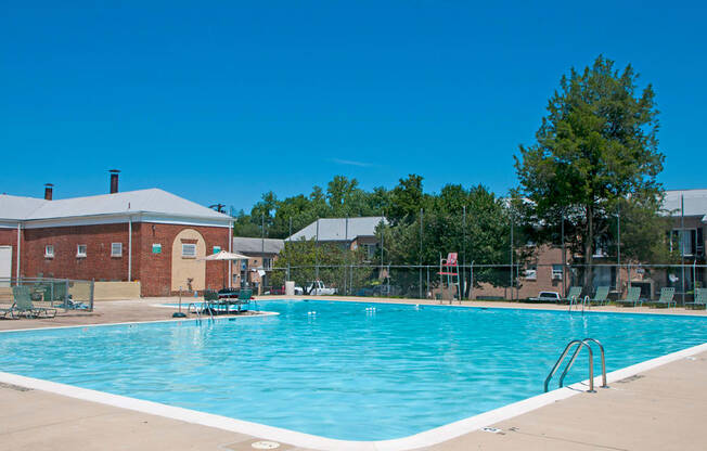 a swimming pool with a building in the background