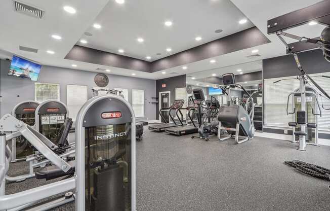 fitness center with free weight and cardio equipment