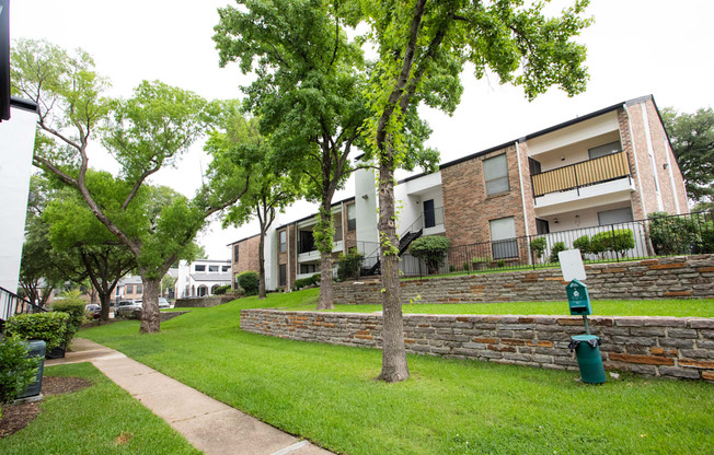 our apartments offer a green lawn and trees for residents to enjoy