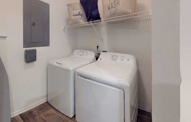 a washer and dryer in a laundry room at Autumn Park Apartments, North Carolina