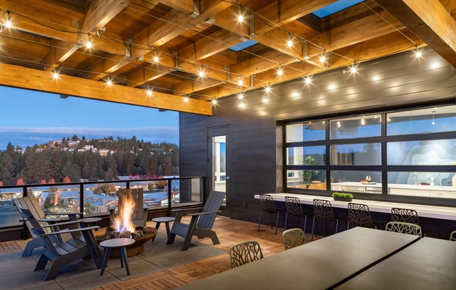 fire pit and rooftop deck at dusk at The Hixon