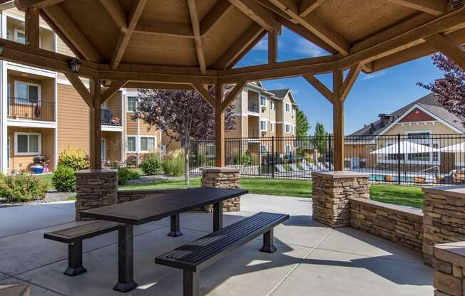 an outdoor patio with a pavilion in front of an apartment building  at Quail Springs, West Richland, 99353