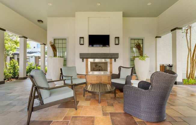 a living room with furniture and a fireplace at Summerwind, Pearland, 77584