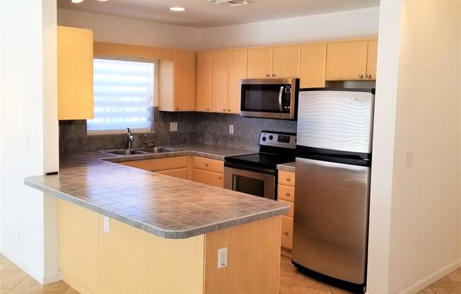 Beautifully maintained 2-bedroom, 2.5-bath townhome with a private fenced backyard and patio