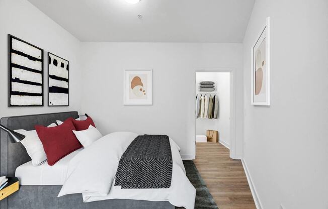 a bedroom with a bed and a closet