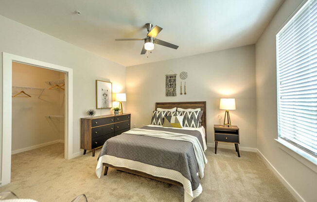 a bedroom with a bed and a ceiling fan at Luxor Club, Jacksonville, 32258