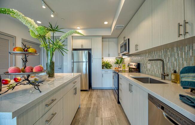 Light‑filled kitchen with granite counters, energy‑efficient appliances, and a clean, streamlined design.