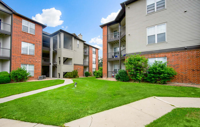 View of our community and apartment buildings surrounded by our beautifully maintained grounds at Greensview Apartments in Aurora, CO