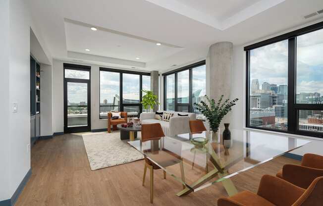 a living room filled with furniture and a large window