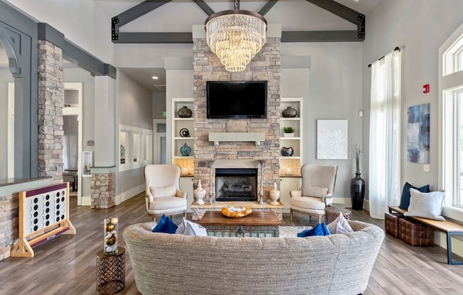 a living room with a large couch and a fireplace