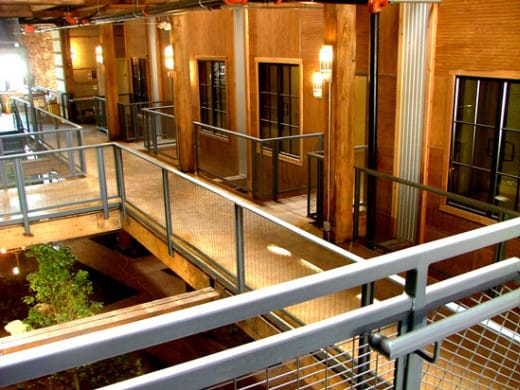 a view of a lobby from a balcony