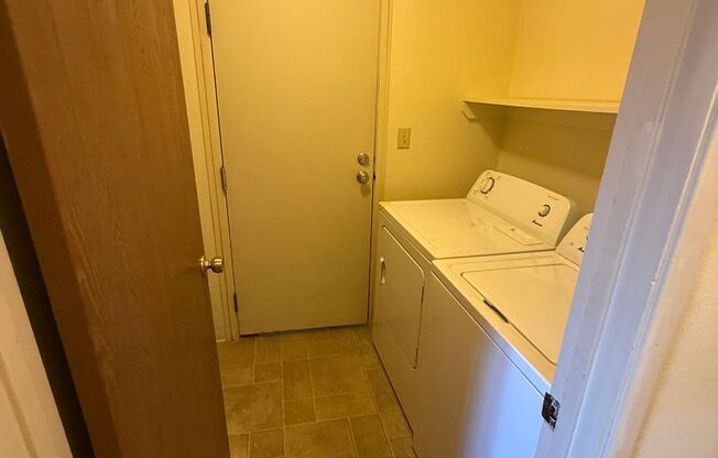 Spacious 2bd First Floor Condo W/Private Patio, Attached Garage, & Private Laundry Room