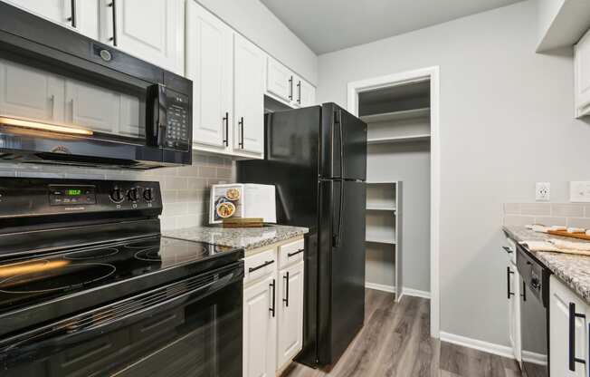 the preserve at ballantyne commons apartment kitchen with black appliances