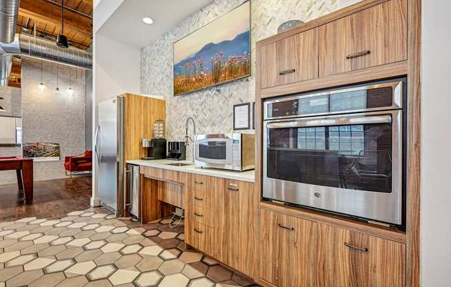 a kitchen with a microwave oven and a refrigerator