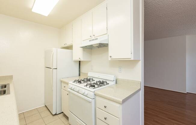 Kitchen with White Appliances and White Cabinets