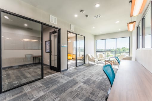 Conference room with glass doors and wide windows at Residences at 3000 Bardin Road, Grand Prairie
