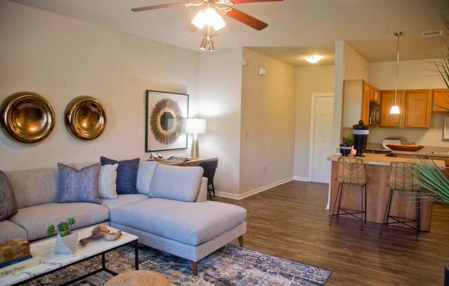 Living Room Come Kitchen View at The Manor Homes of Eagle Glen, Raymore, Missouri