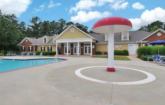 Swimming pool with lounge chairs, tanning deck.