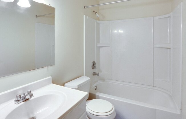 a bathroom with a sink toilet and a bath tub