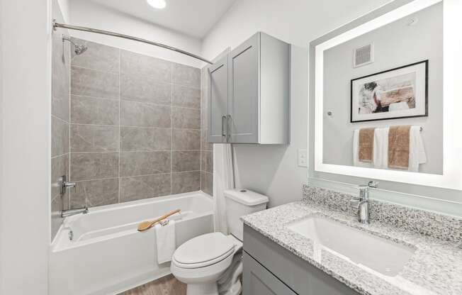 a bathroom with a sink toilet and a bath tub