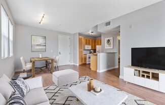 a living room with a couch and a table and a television