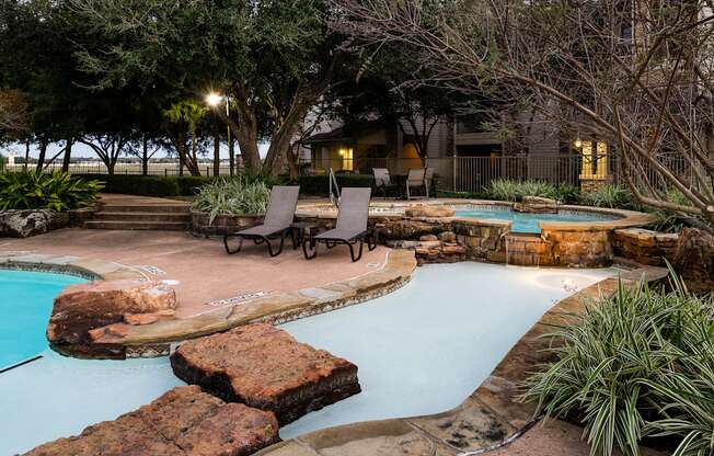 A backyard with a pool and a patio area.