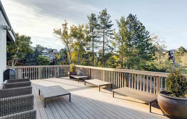 the deck has a view of the mountains and trees at Ashford Belmar Apartments, Lakewood