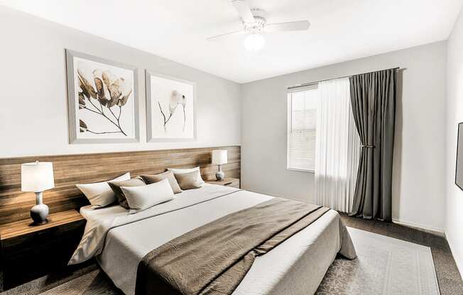 Virtually staged bedroom with carpet, accent rug, wooden headboard with night stand, wall art and window curtain with sheer