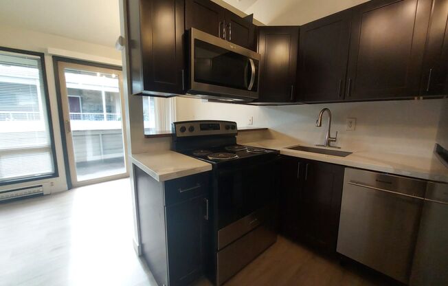 1BR Apartment with Large Patio and Rare Off-Street Parking Near Green Lake & Fremont
