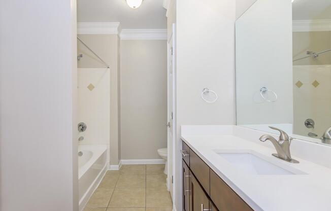 a room with a sink and a mirror