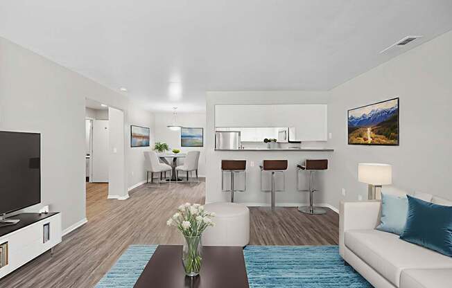 A modern living room with a bar area and a television.