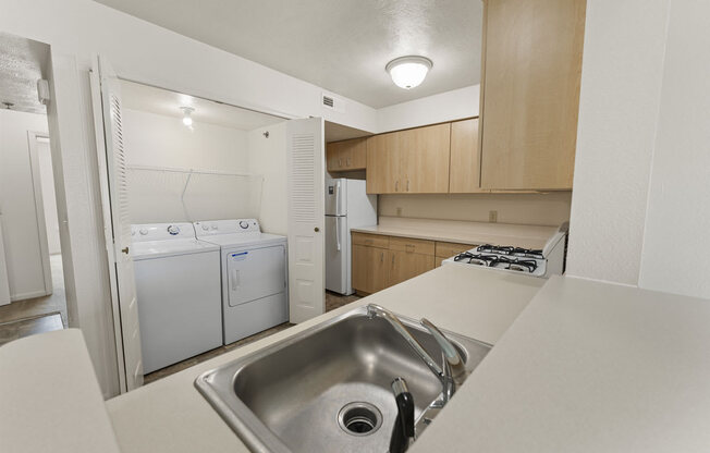 a kitchen with washer and dryer at Hunters Pond Apartment Homes, Champaign, IL