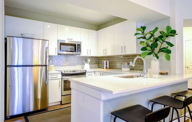 Luxury Kitchen with stainless steel appliances and quartz countertops at Sophia at Abacoa apartments