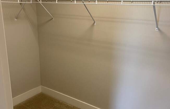 Walk-in closet with shelving system at Flats on 4th Apartments in Birmingham, AL