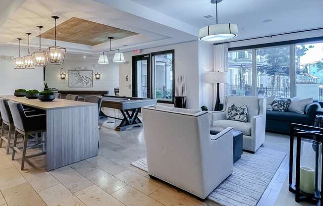 Resident lounge seating areas and large windows  at Two Addison Place Apartments , Georgia