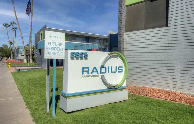 a sign in front of a building with the radus logo