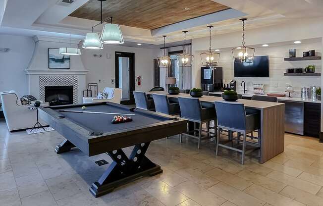 Resident lounge with billiards tables at Two Addison Place Apartments , Pooler, GA