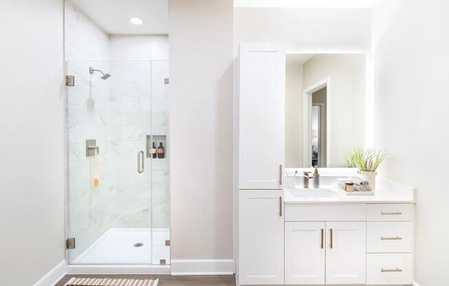 Indulge in luxury at Modera Waugh! Our designer bathrooms boast quartz countertops, dual vanities, and sleek LED mirrors, complemented by frameless glass showers.