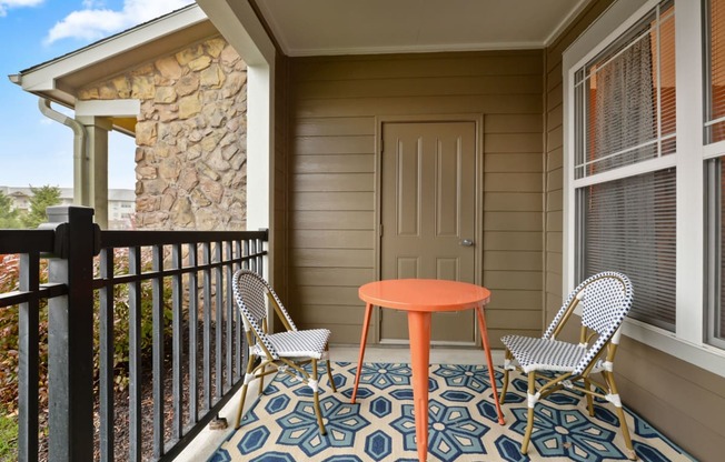 Riverstone Apartments Private Patio with Black Fence and Room for Table and Chairs