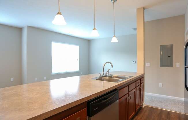 a kitchen with a large counter top and a sink