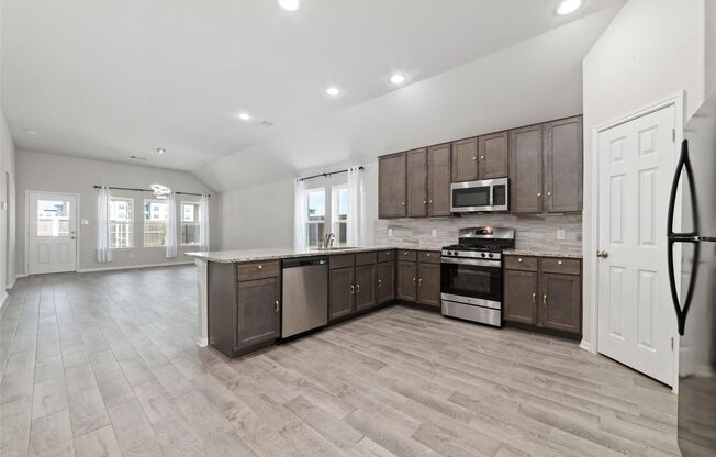 Love every moment spent in this incredible Lake Ridge Builders home in Morton Creek Ranch. Resting on a corner lot, this 3-sided brick home boasts a premium elevation, no back neighbors, wood-look tile flooring, a sprinkler system, faux wood blinds, and a