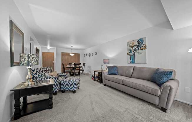 Spacious living room with natural light at Westwood Village Apartments in Westland, MI