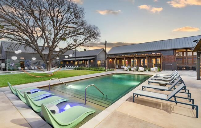 Evenings by the two pools at Modera McKinney Ridge offer a peaceful, inviting retreat with ample space to lounge and unwind.